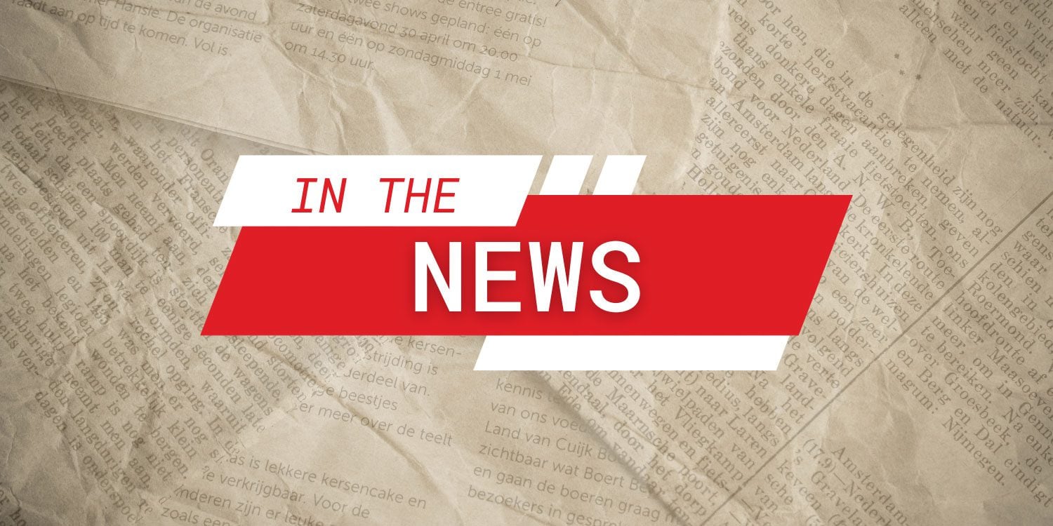 Headline graphic "IN THE NEWS" over a newspaper background.